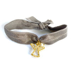 Pulsera elástica gris con angelito chapado y perlita